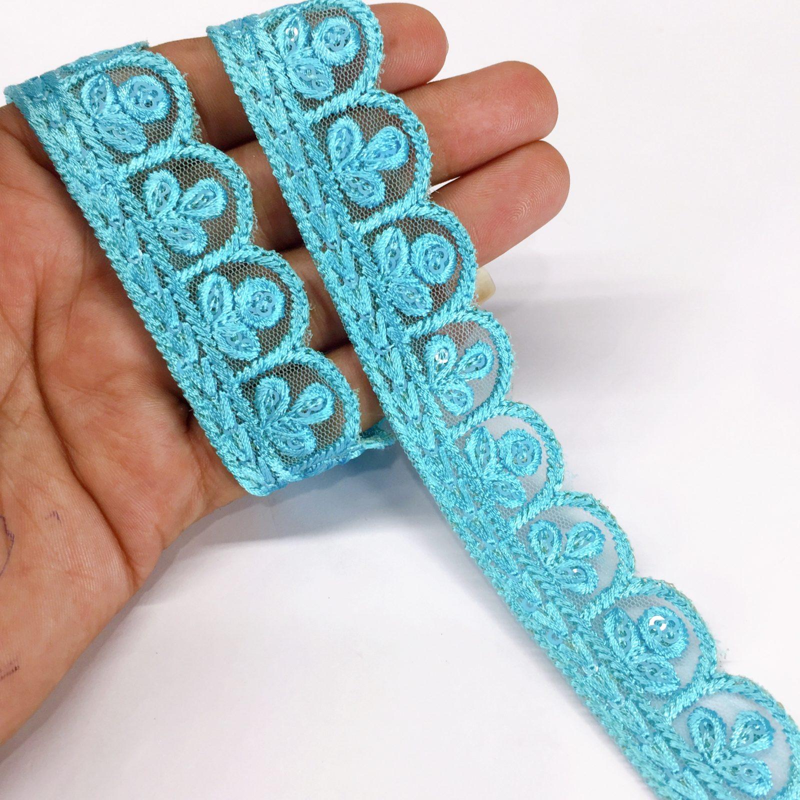 25mm Jute Flower Design Embroidery Cutwork lace with Matching Sequins Work Border, shown on white cotton