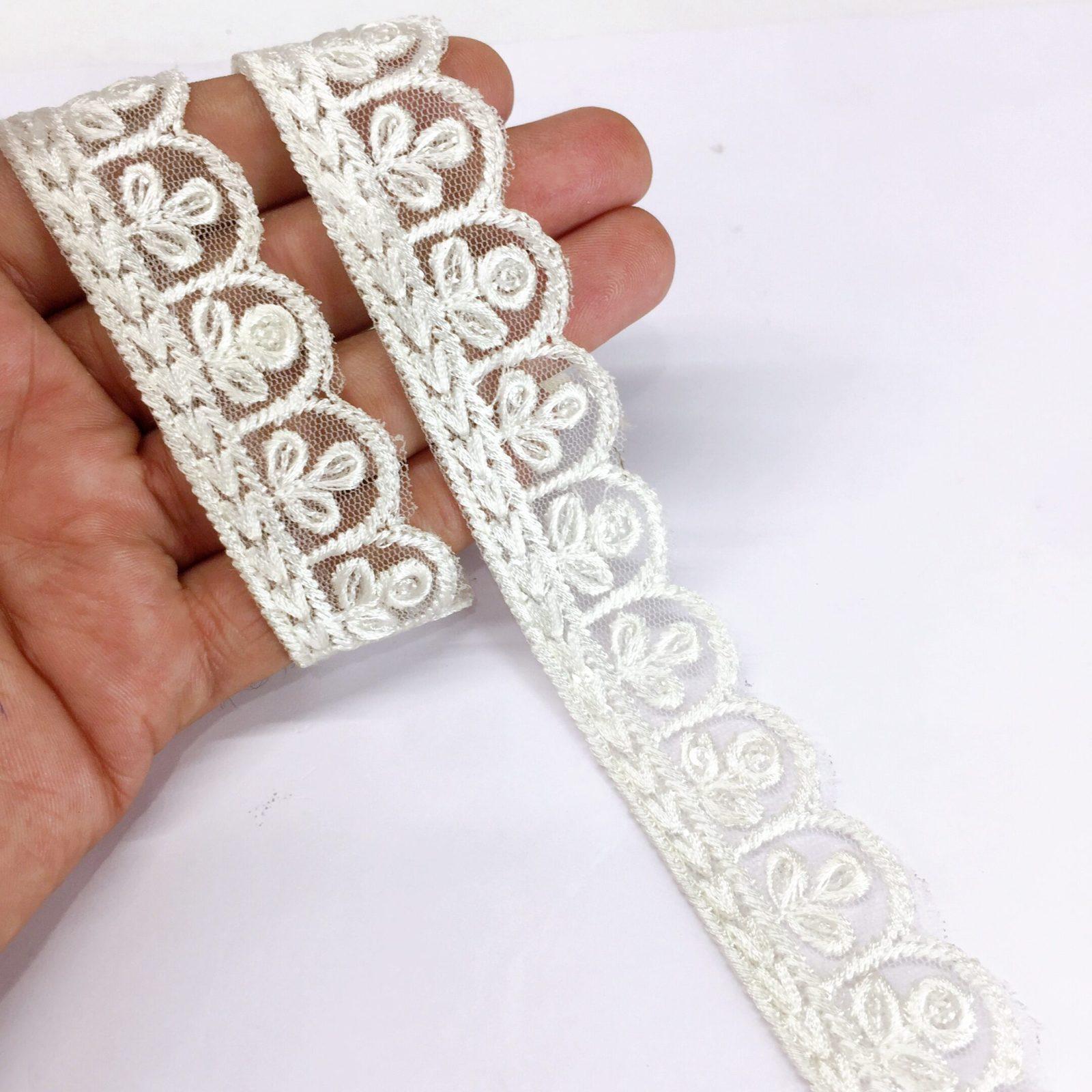 25mm Jute Flower Design Embroidery Cutwork lace with Matching Sequins Work Border, shown on white cotton