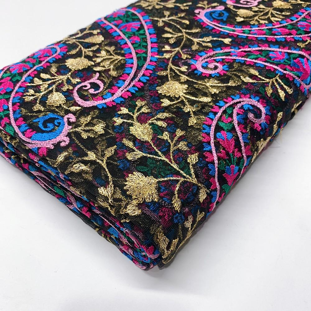Embroidery Work on Net Fabric, shown on white cotton