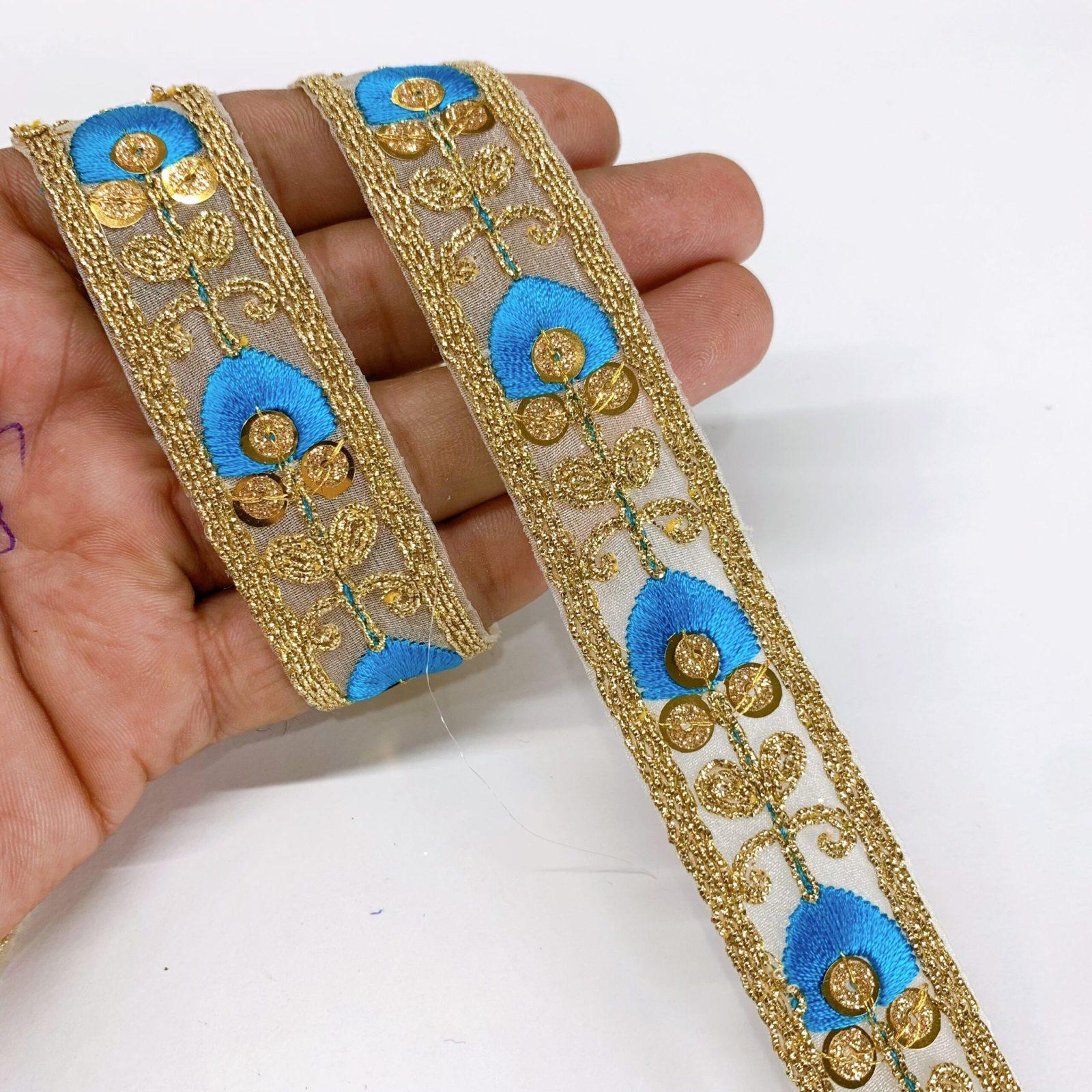20mm Leaf Design Embroidery lace with Golden Sequins and Dori Work Border, shown on white cotton