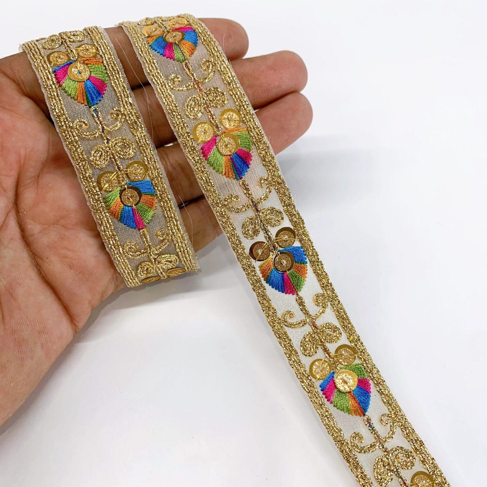 20mm Leaf Design Embroidery lace with Golden Sequins and Dori Work Border, shown on white cotton