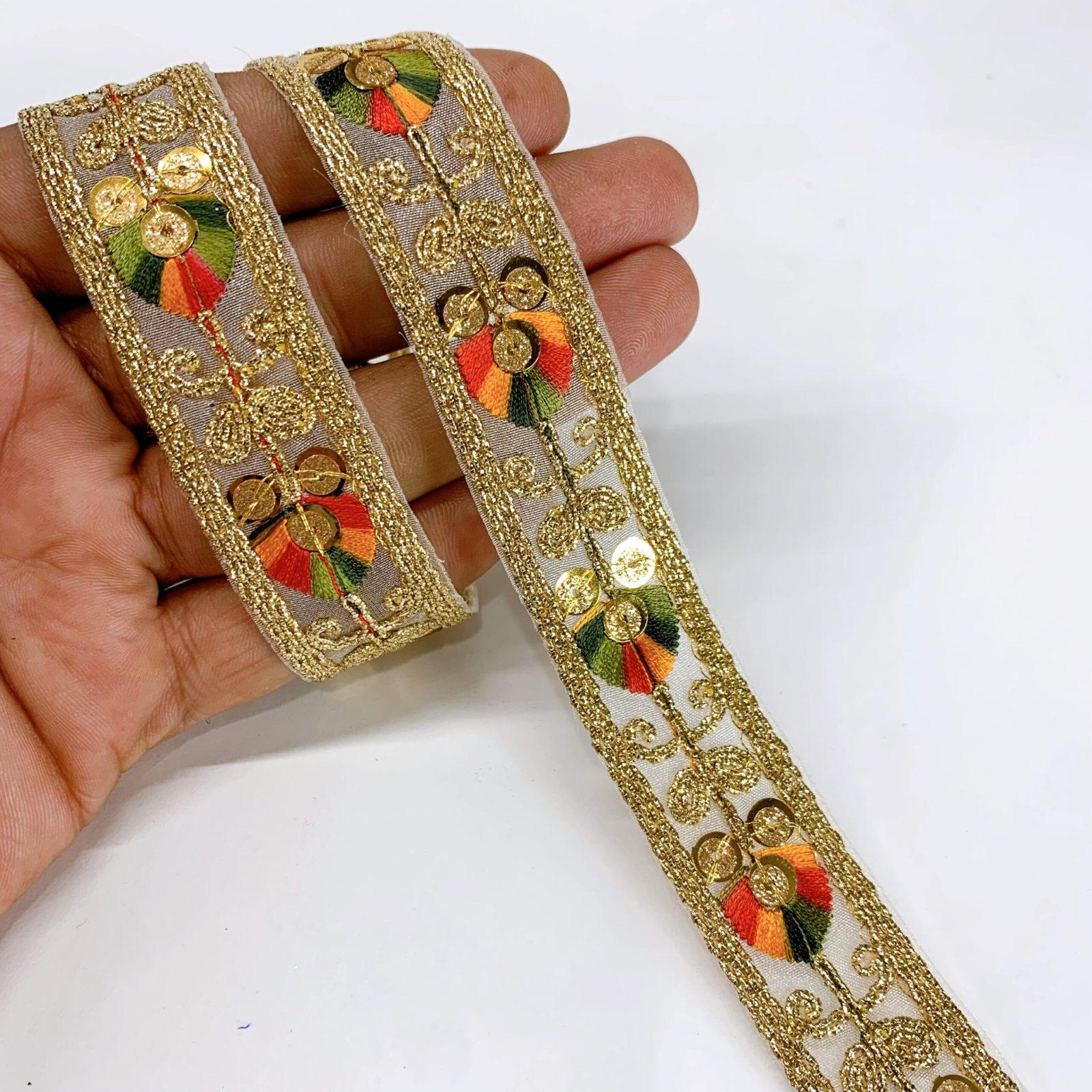 20mm Leaf Design Embroidery lace with Golden Sequins and Dori Work Border, shown on white cotton