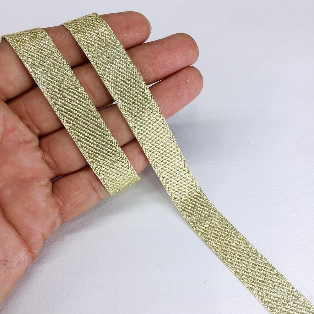 15 mm Metallic Glitter Twill Weave Ribbon, shown on white cotton