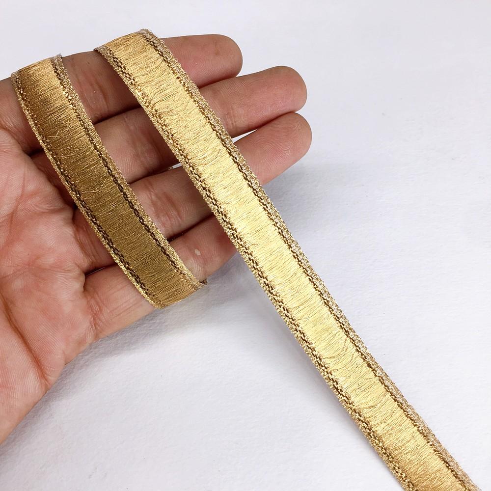 13 mm Thick Gold Metallic Zari Ribbon, shown on white cotton