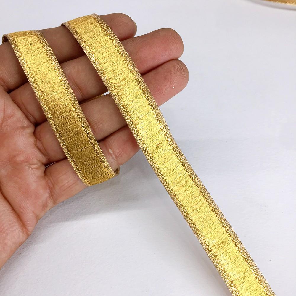13 mm Thick Gold Metallic Zari Ribbon, shown on white cotton
