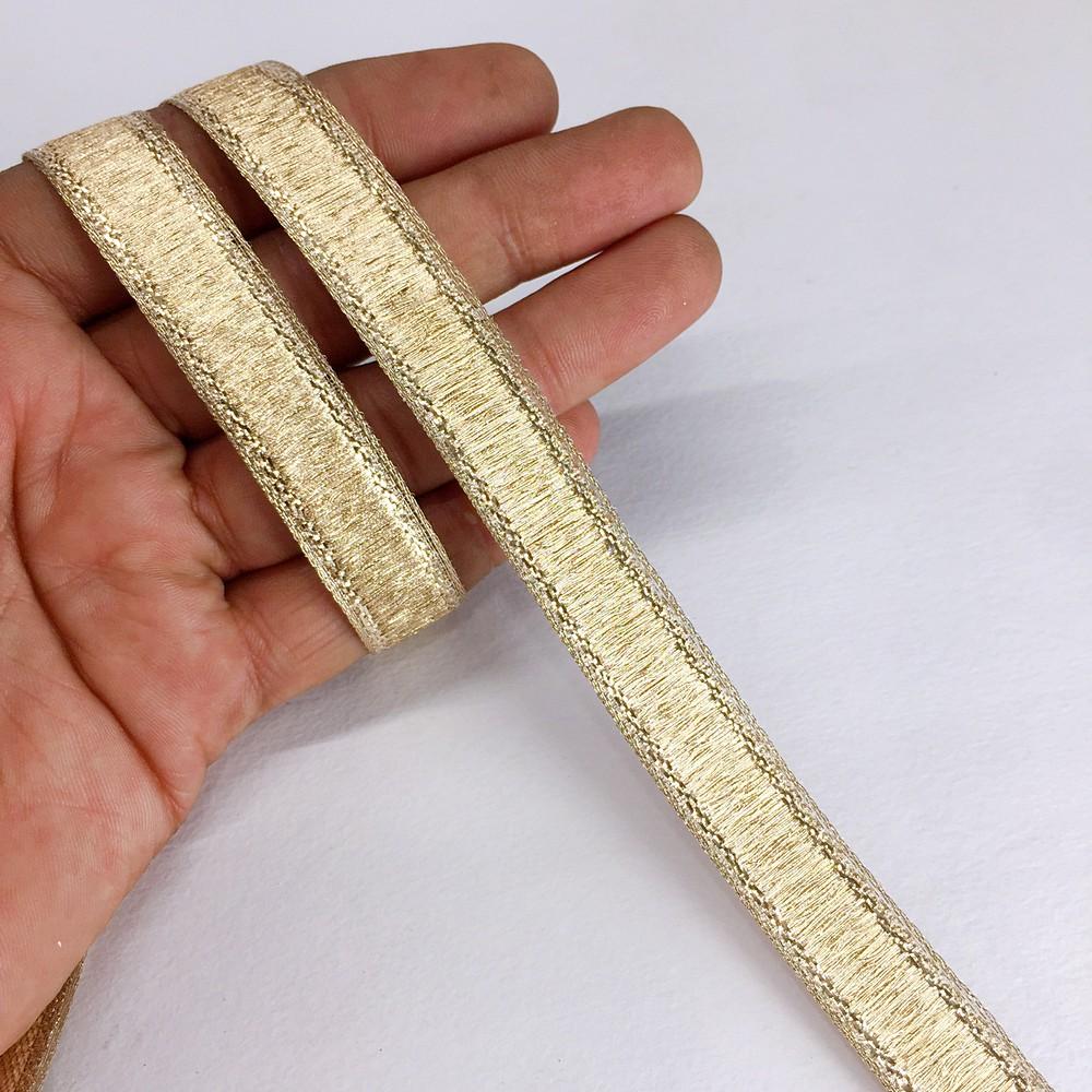 13 mm Thick Gold Metallic Zari Ribbon, shown on white cotton