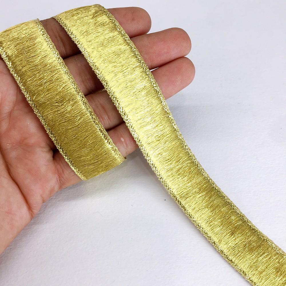24 mm Thick Gold Metallic Zari Ribbon, shown on white cotton