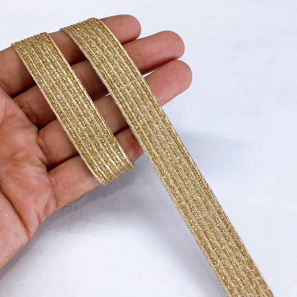 15 mm Metallic Ribbon with 6 Embossed Gold Zari Cords, shown on white cotton