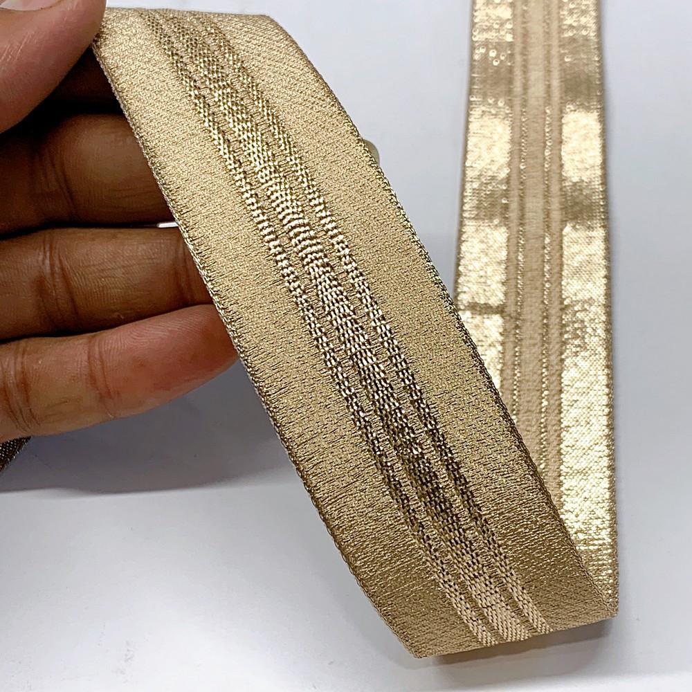 32 mm Thick Gold Metallic Zari Ribbon with Shiny Stripe, shown on white cotton