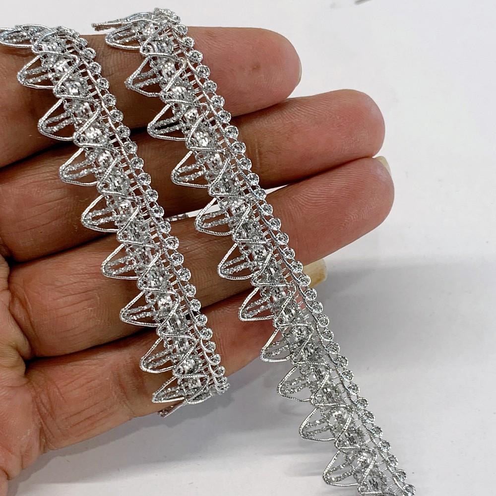 14 mm Knitted Decorative Ribbon, shown on white cotton