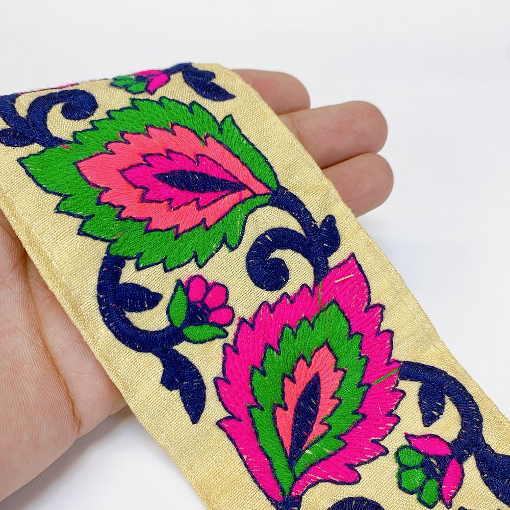 65mm Parsi Flower Design Embroidery Lace, shown on white cotton