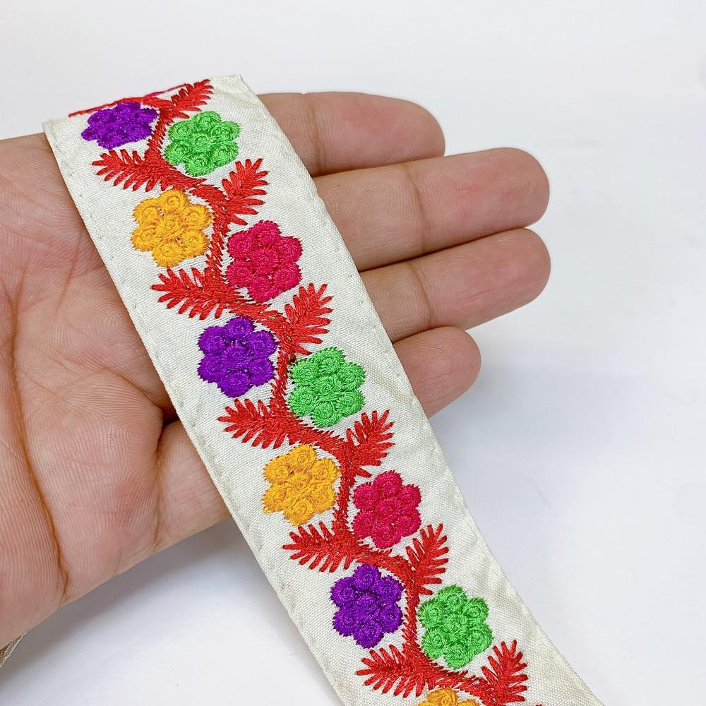 32 mm Designer Parsi Flower Embroidery Lace, shown on white cotton