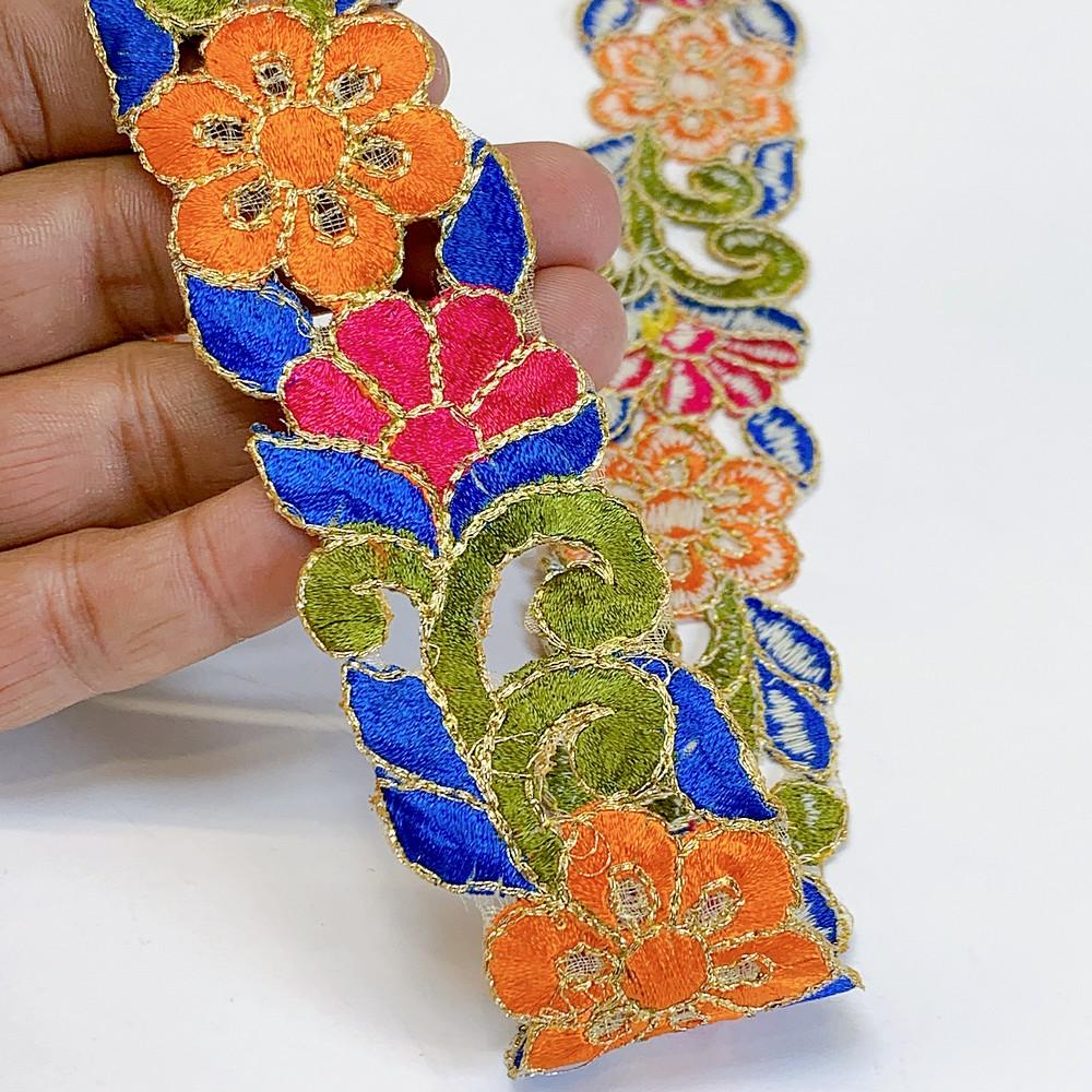 25mm Designer Cutwork Embroidery Lace, shown on white cotton