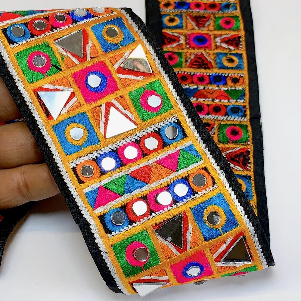 70mm Designer Kutchi Multicolour Embroidery Lace With Mirror Work, shown on white cotton