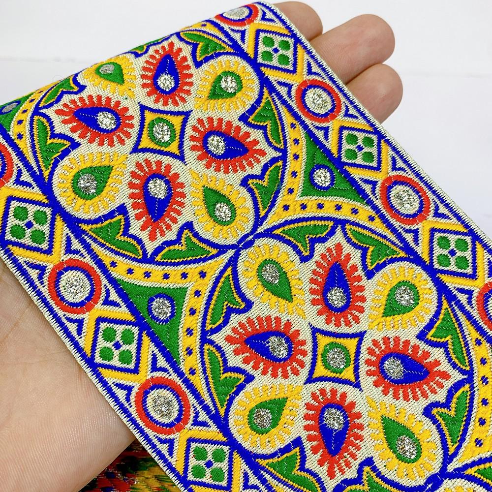 100mm Kutchi Design Jacquard Lace With Zari Work, shown on white cotton