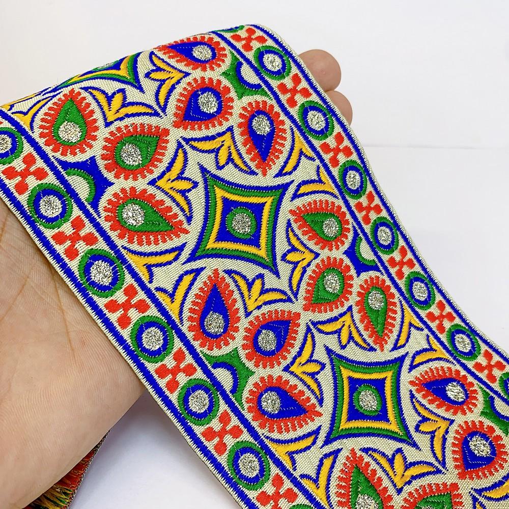 100mm Kutchi Design Jacquard Lace With Zari Work, shown on white cotton