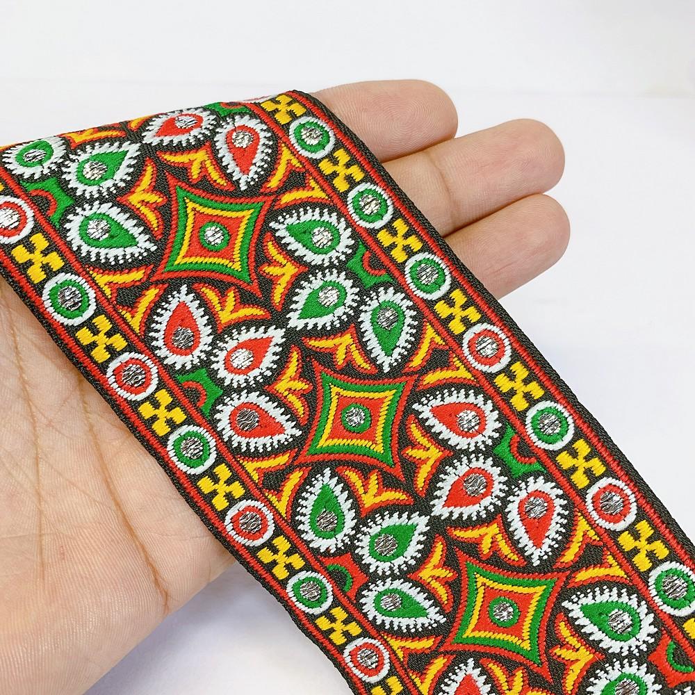 66 mm Kutchi Design Jacquard Lace With Zari Work, shown on white cotton