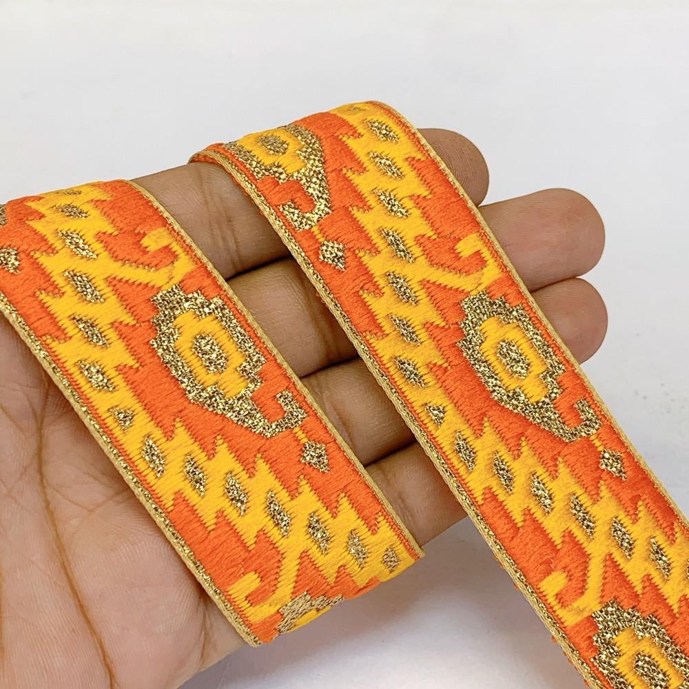 30mm Designer Jacquard Lace With Golden Zari Thread Work, shown on white cotton