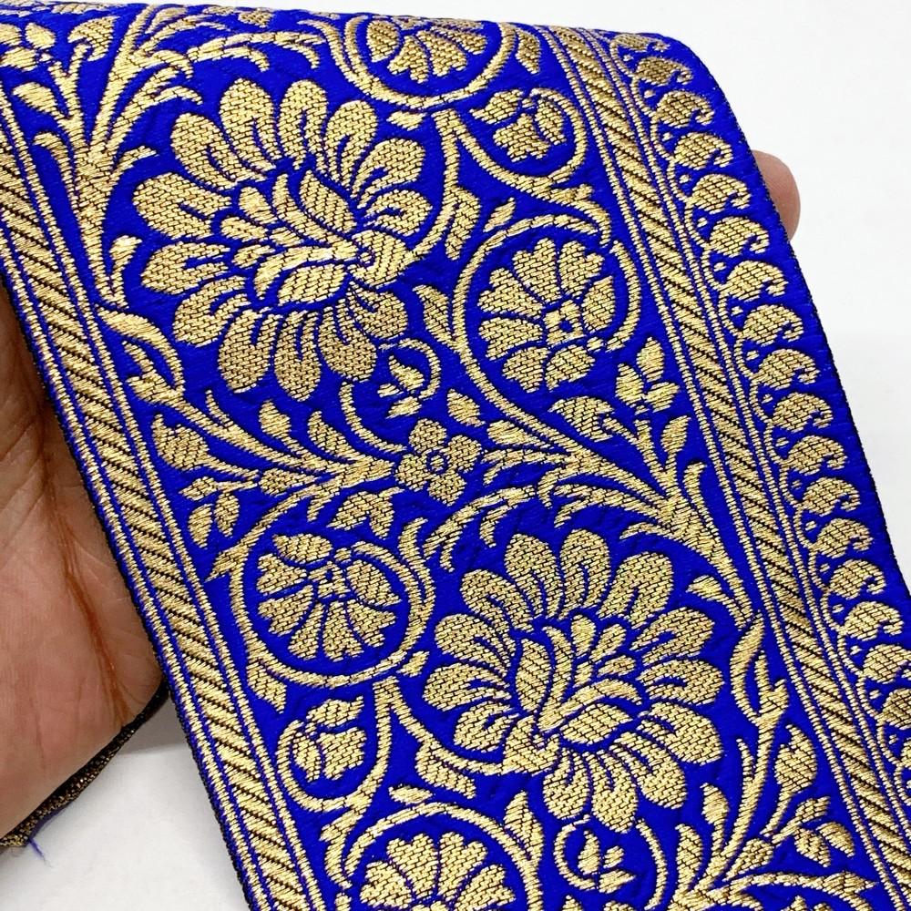 100mm Designer Foral Golden Banarasi Lace, shown on white cotton