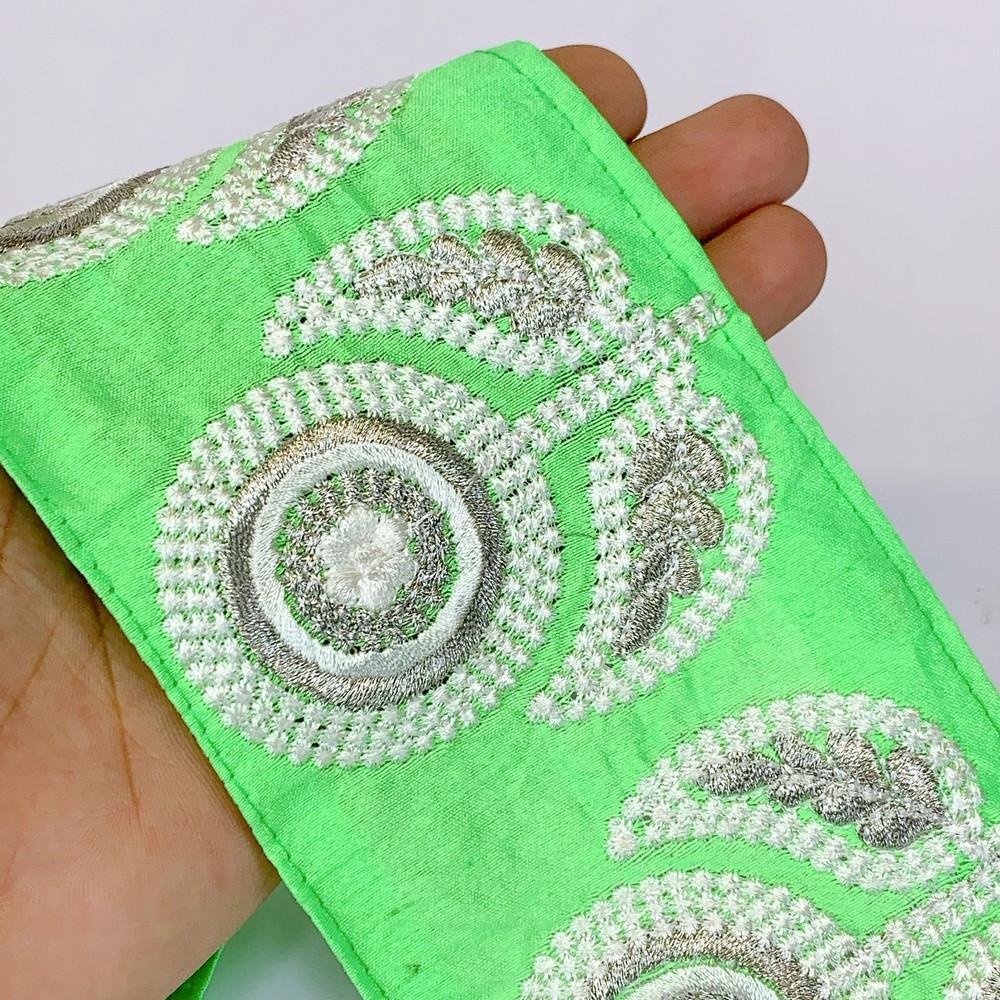 88 mm Designer Flower Butta Embroidery Lace, shown on white cotton