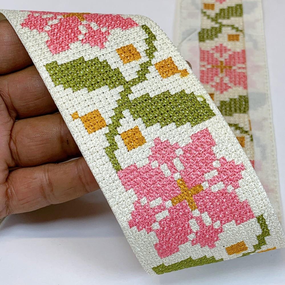 Lami 56 mm Designer Crossstitch Embroidery Lace, shown on white cotton