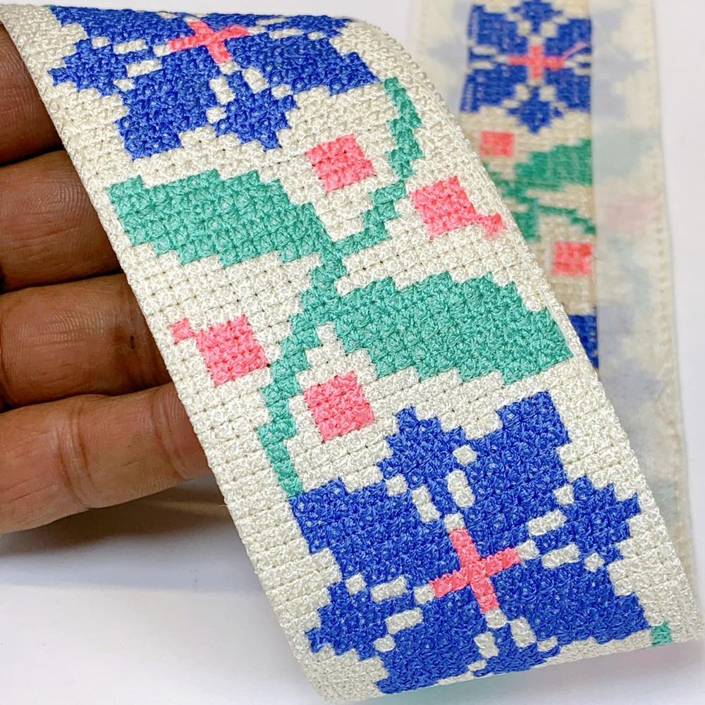 Lami 56 mm Designer Crossstitch Embroidery Lace, shown on white cotton