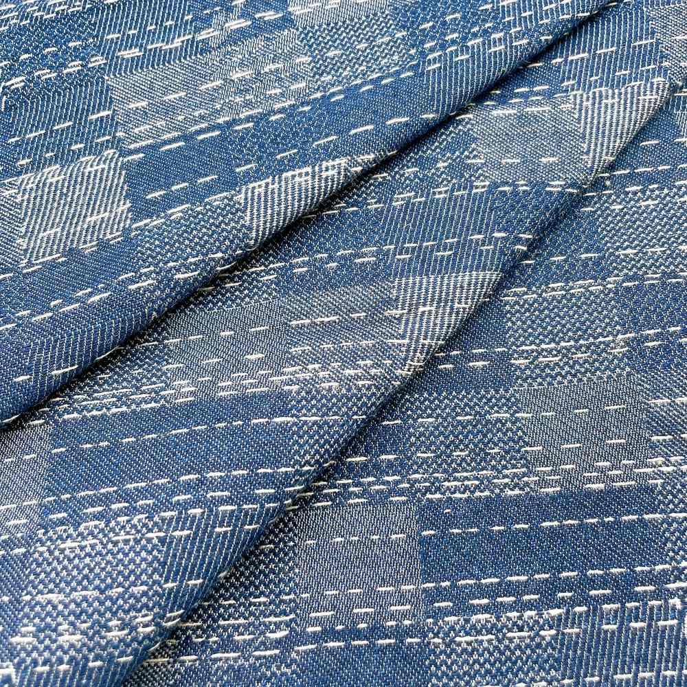 9oz Blue Abstract Sashiko Style Jacquard Denim Fabric, shown on white cotton