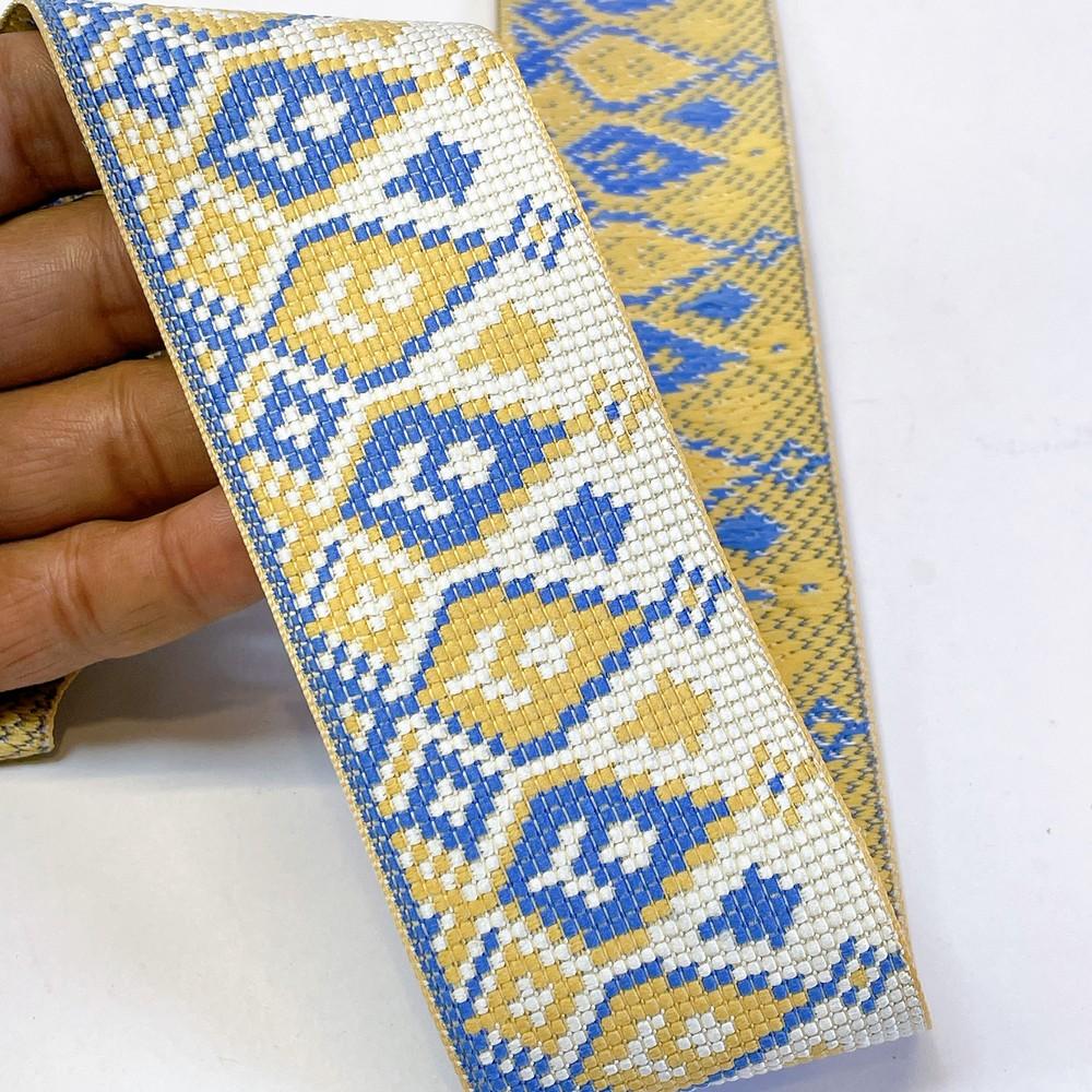 52mm Premium Cross-Stitch Jacquard Ribbon - Ethnic Geometric Border Lace for Garments & Crafts, shown on white cotton