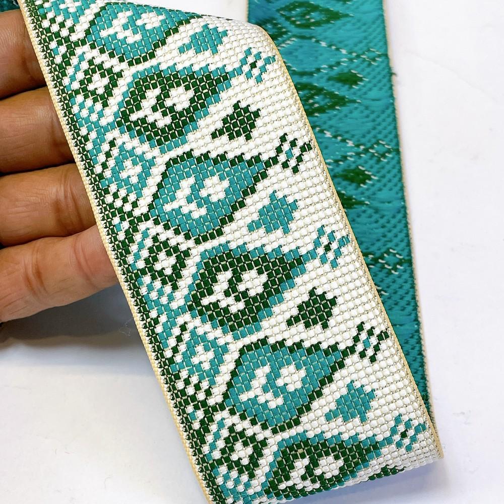 52mm Premium Cross-Stitch Jacquard Ribbon - Ethnic Geometric Border Lace for Garments & Crafts, shown on white cotton