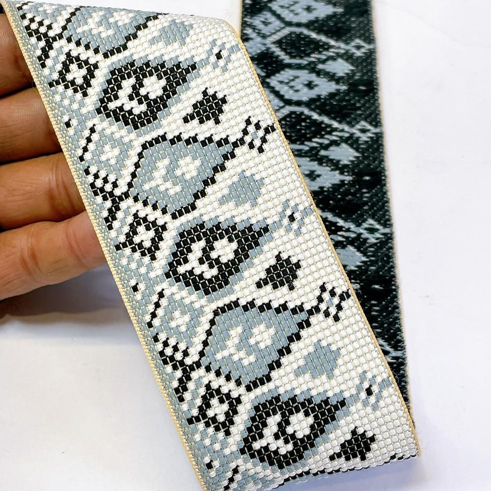 52mm Premium Cross-Stitch Jacquard Ribbon - Ethnic Geometric Border Lace for Garments & Crafts, shown on white cotton