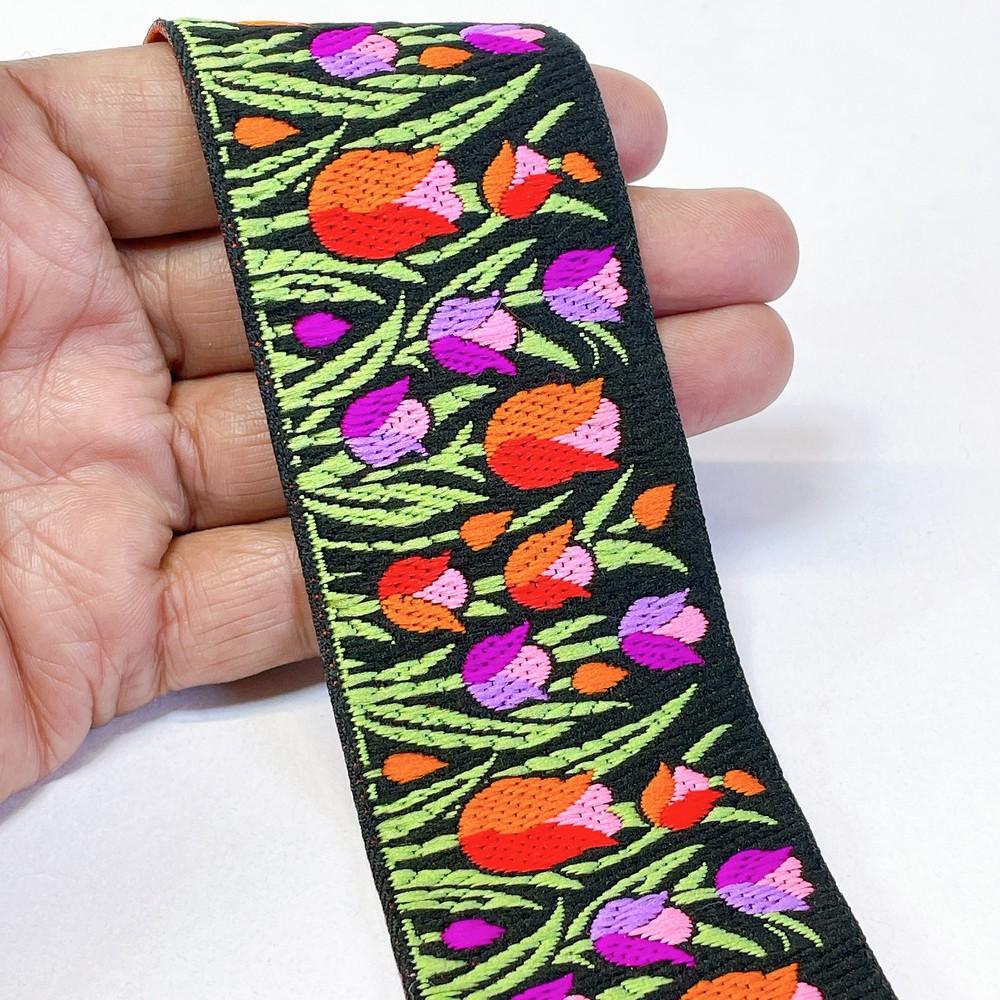 48mm Woven Jacquard Tulip Ribbon | Floral Garden Ethnic Trim | 1.9-Inch Multi-Color Jacquard Border for Boutique Fashion, shown on white cotton