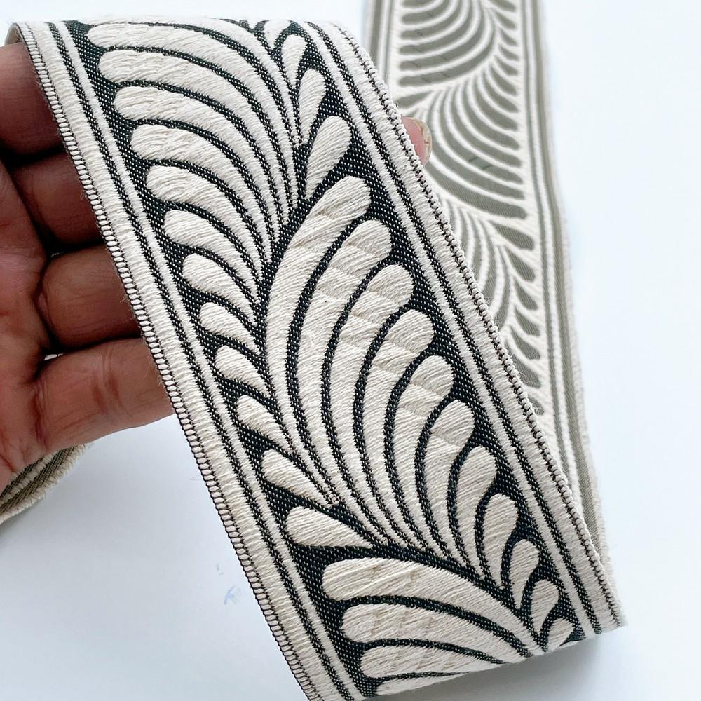 58mm Wide Botanical Leaf Pattern Lace Border for Sewing, Garments, DIY Crafts & Home Decor, shown on white cotton