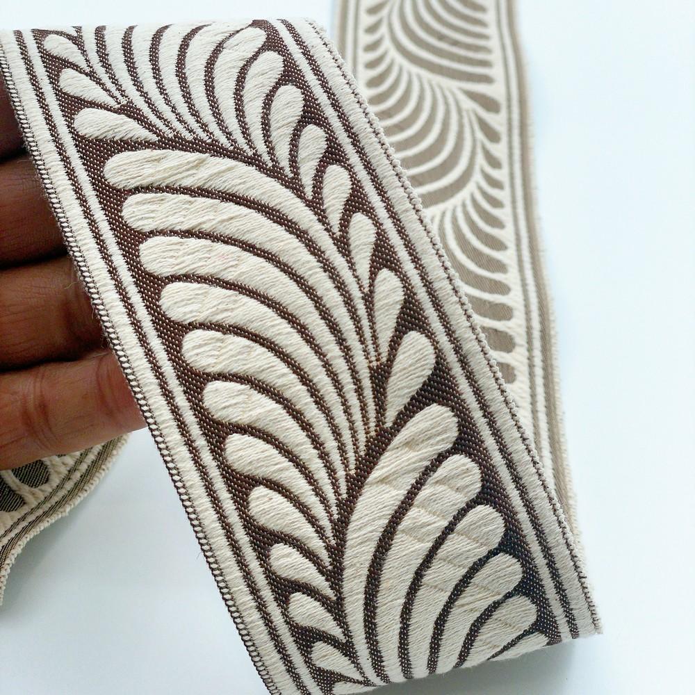 58mm Wide Botanical Leaf Pattern Lace Border for Sewing, Garments, DIY Crafts & Home Decor, shown on white cotton