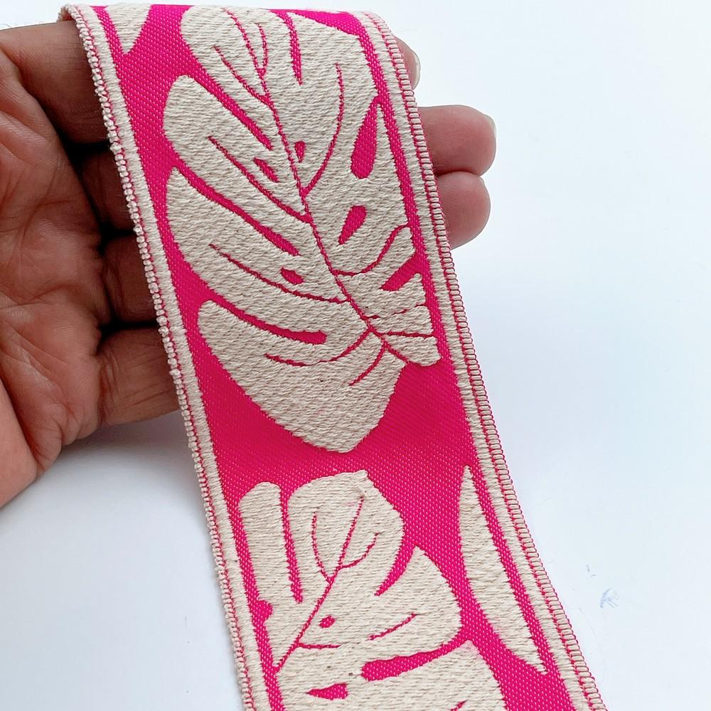 58mm Wide Tropical Monstera Leaf Pattern Lace Border for Sewing, Garments, DIY Crafts & Home Decor, shown on white cotton