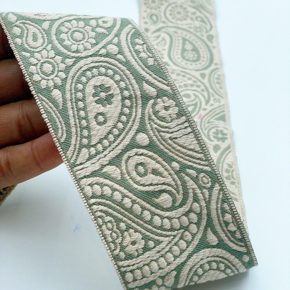 55mm Wide Traditional Paisley Motif Lace Border for Sewing, Garments, DIY Crafts & Home Decor, shown on white cotton