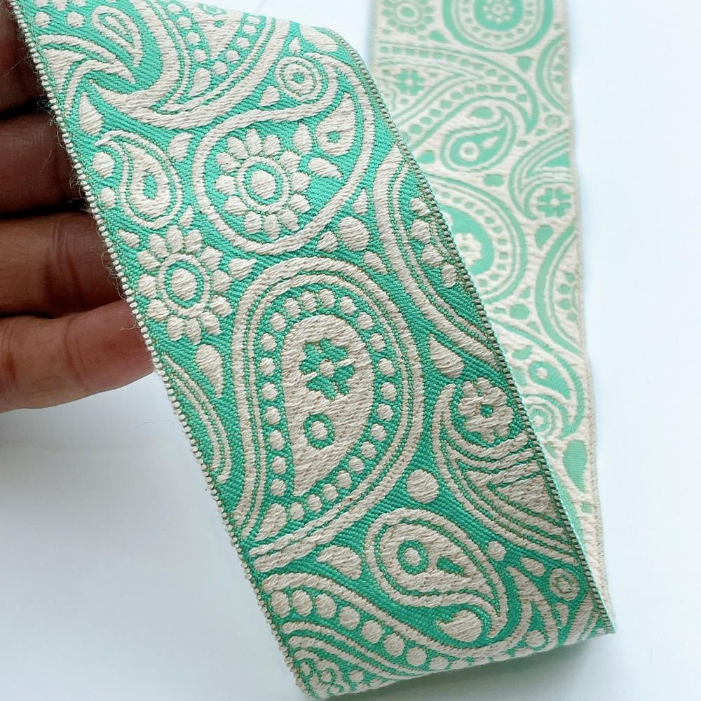 55mm Wide Traditional Paisley Motif Lace Border for Sewing, Garments, DIY Crafts & Home Decor, shown on white cotton