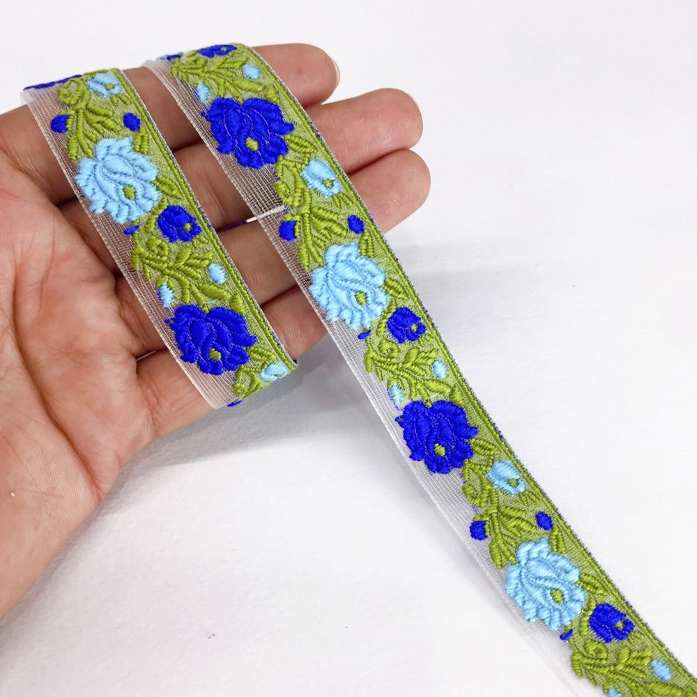 20mm flower creeper vine trim, shown on white cotton