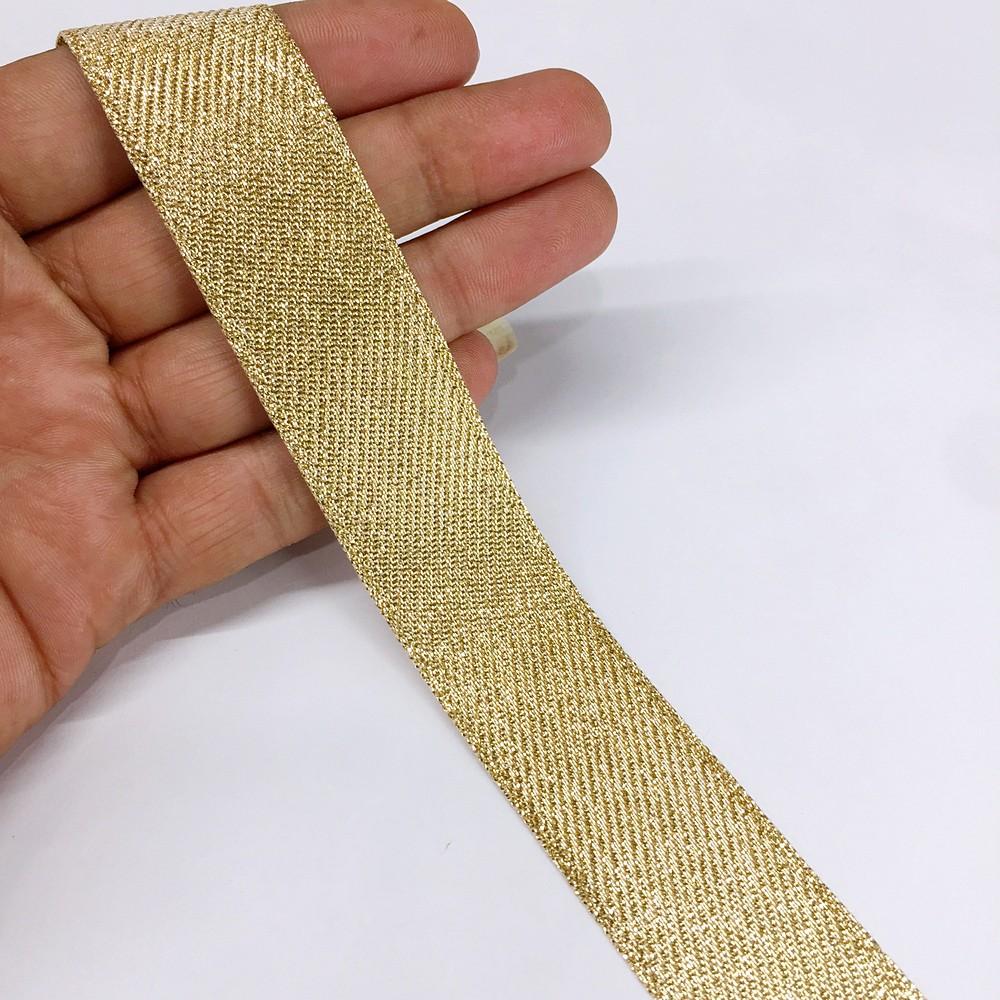 30mm Dark Gold jacquard ribbon, shown on white cotton