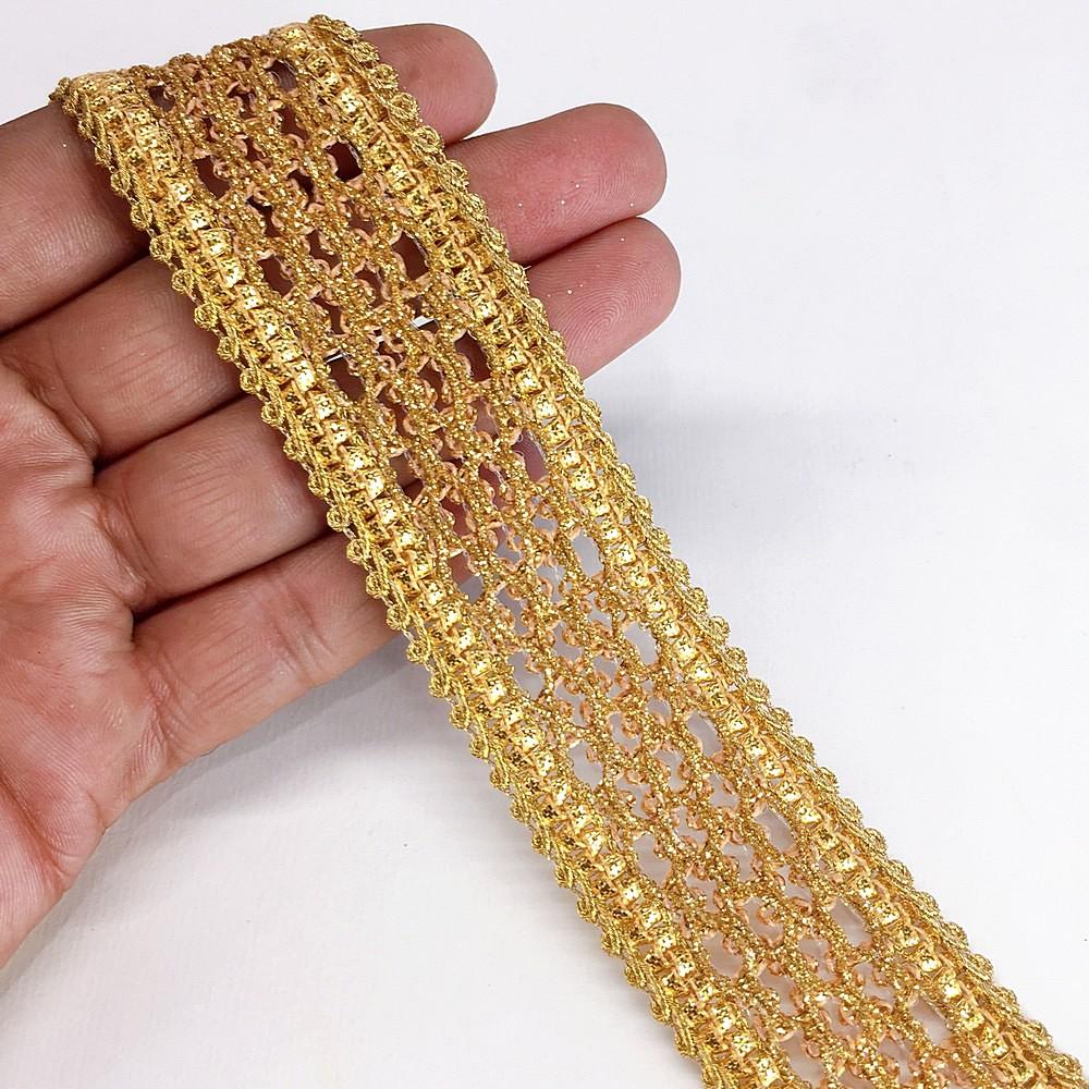 35mm Anmol Knitted Decorative Ribbon, shown on white cotton