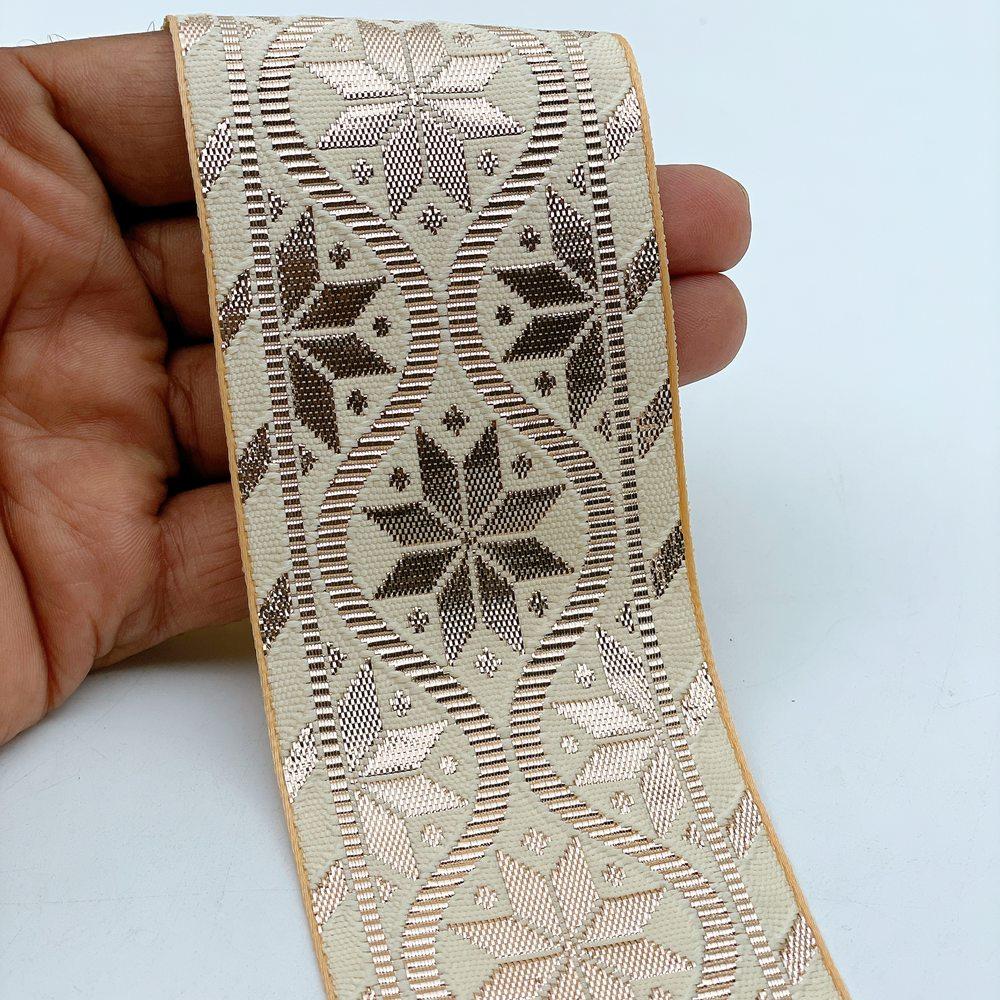 60mm Wide Gota Work Jacquard Ribbon - Wavy Floral Trellis Border Lace, shown on white cotton