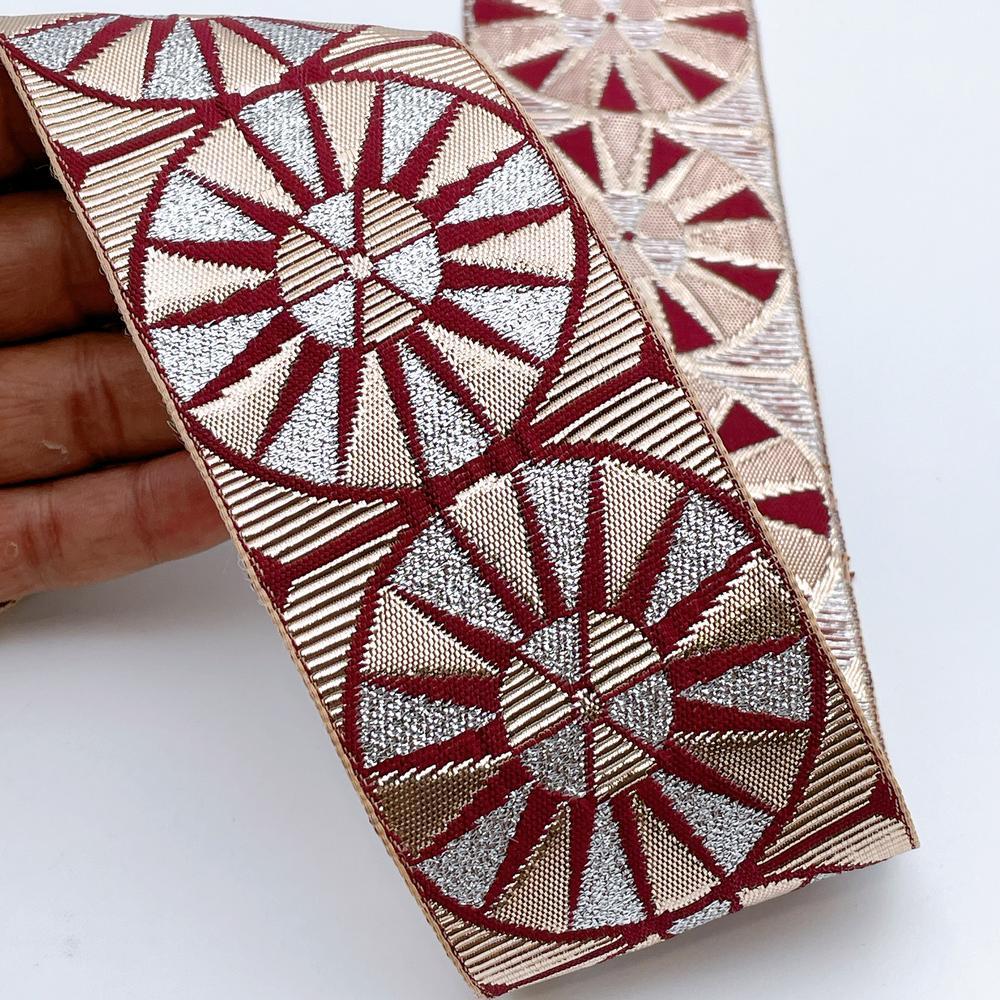 60mm Wide Colorful Sunburst Gota Work Jacquard Ribbon - Woven Border, shown on white cotton