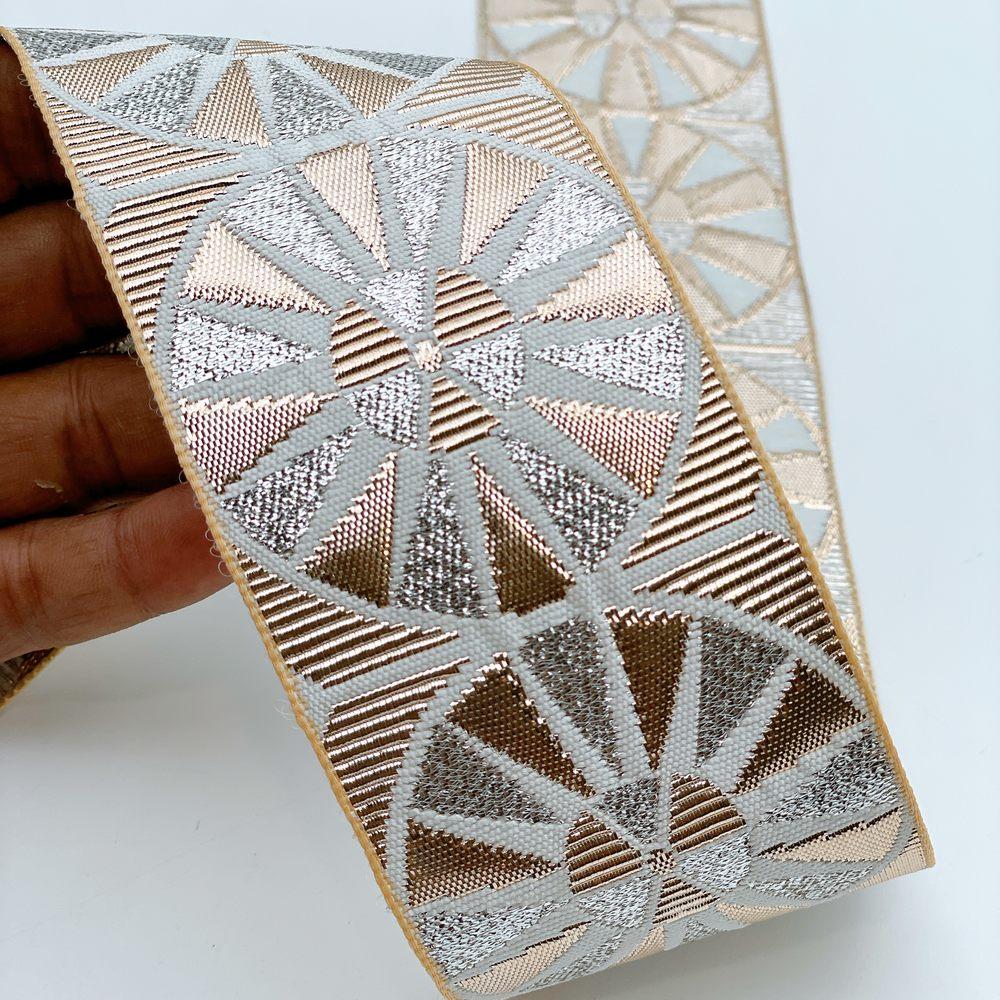60mm Wide Colorful Sunburst Gota Work Jacquard Ribbon - Woven Border, shown on white cotton