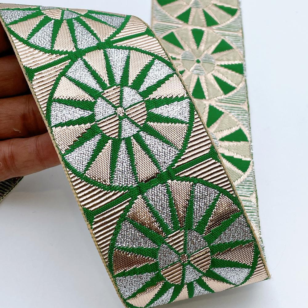 60mm Wide Colorful Sunburst Gota Work Jacquard Ribbon - Woven Border, shown on white cotton