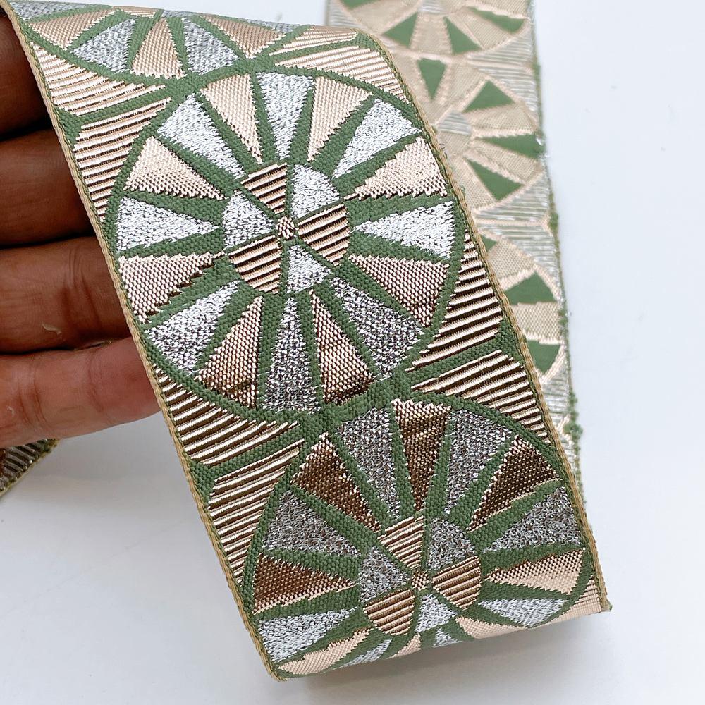 60mm Wide Colorful Sunburst Gota Work Jacquard Ribbon - Woven Border, shown on white cotton