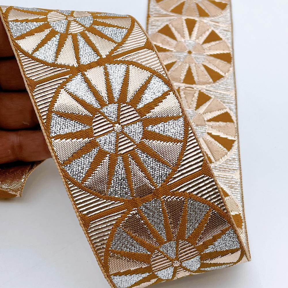 60mm Wide Colorful Sunburst Gota Work Jacquard Ribbon - Woven Border, shown on white cotton