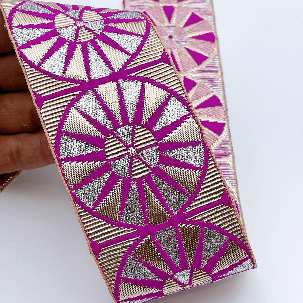 60mm Wide Colorful Sunburst Gota Work Jacquard Ribbon - Woven Border, shown on white cotton