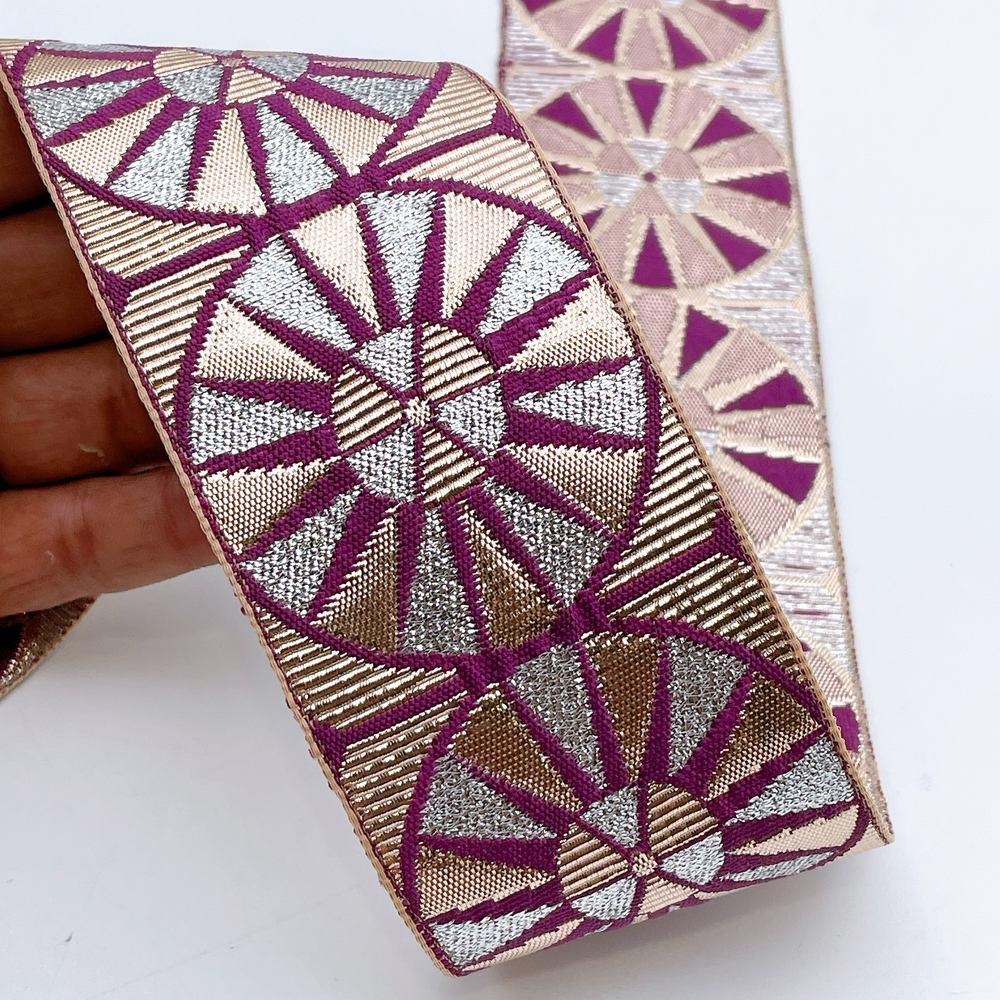 60mm Wide Colorful Sunburst Gota Work Jacquard Ribbon - Woven Border, shown on white cotton