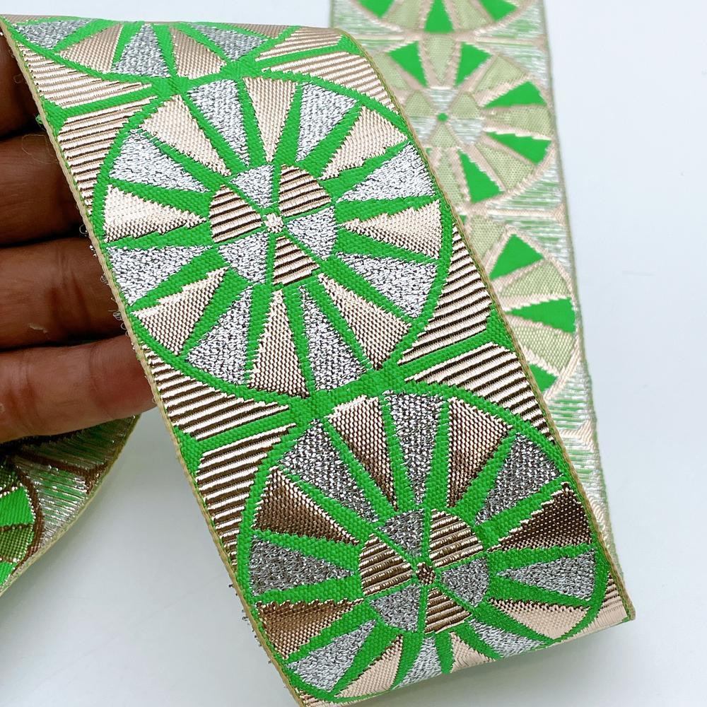60mm Wide Colorful Sunburst Gota Work Jacquard Ribbon - Woven Border, shown on white cotton