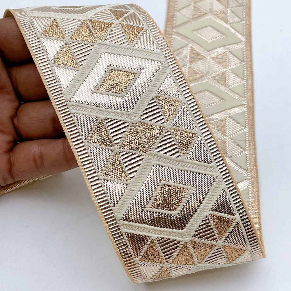 60mm Wide Gota Work Jacquard Ribbon - Metallic Diamond & Triangle Border, shown on white cotton