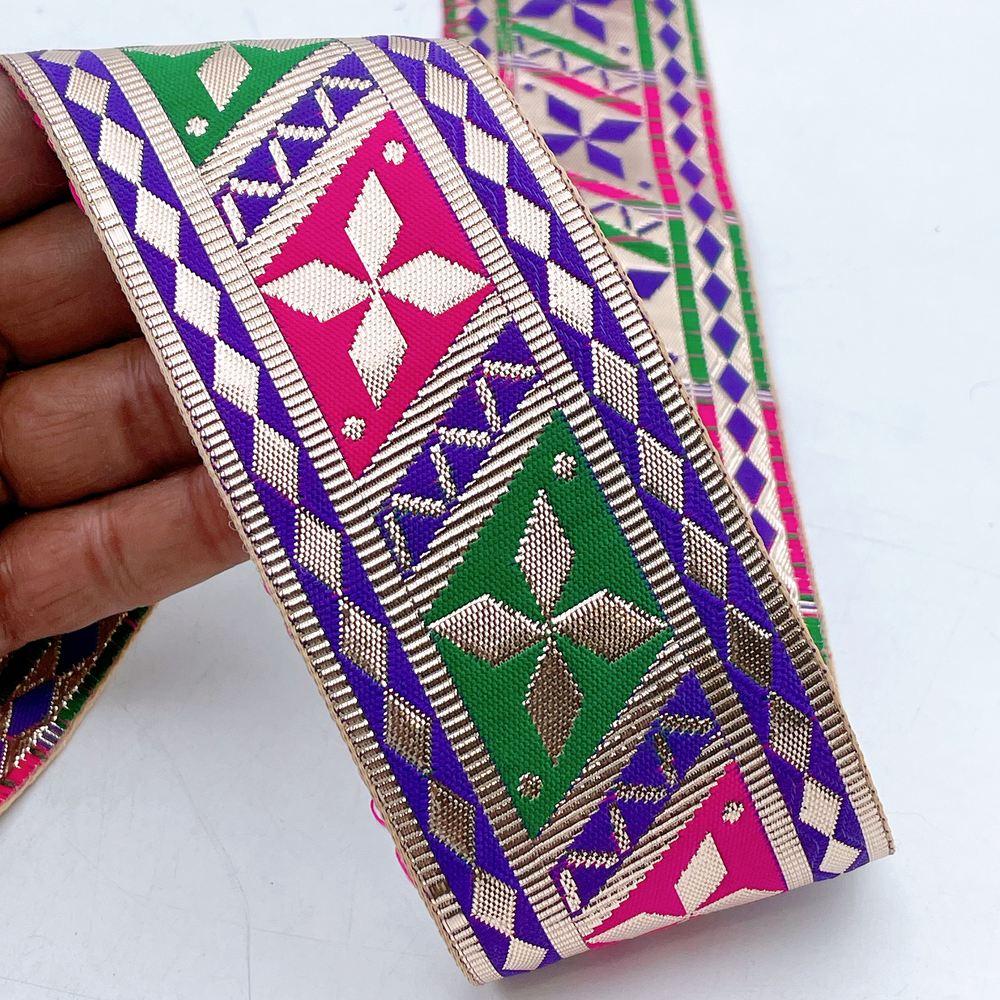 58mm Wide Colorful Geometric Floral Gota Work Jacquard Ribbon, shown on white cotton